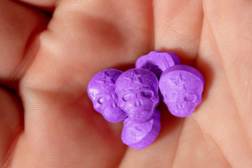 amphetamine, Blue, pink, purple army Skull, Ecstasy, XTC pills isolated on a white background.