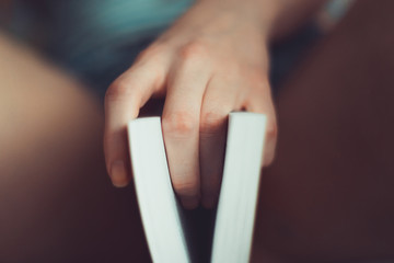 Vagina symbol. Two fingers on book on bed. Woman read love novel. Sex concept. Womens secrets....