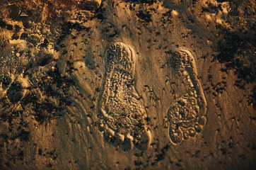 footprints on the sand background texture. summer