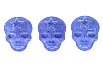 Blue MDMA, Amphetamine, Army Skull, Ecstasy, XTC pills isolated on a white background.