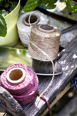 Three colored balls of twine on a garden table