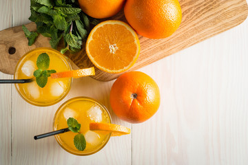 Photo of fresh orange juice in the glass jar. Summer healthy organic drink concept. Cold beverages...