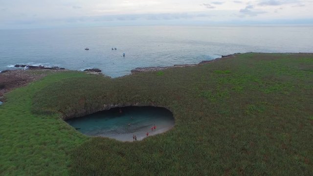 Aerial pull back shot of the hidden beach of the Isla Redonda, Marietas Islands, Nayarit, Mexico