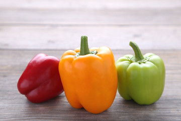 Colorful pepper on a grey wooden background