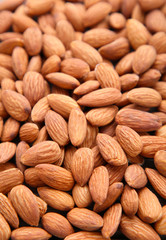 Organic almond nuts as background, top view. Healthy snack