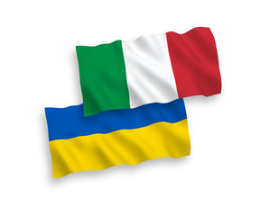 National vector fabric wave flags of Italy and Ukraine isolated on white background. 1 to 2 proportion.