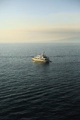 boat in the sea, mountain on the background of the sea.