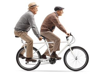 Two senior men riding a tandem bicycle