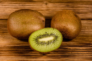 Ripe kiwi fruits on a wooden table