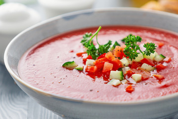 Tasty summer tomato soup served in bowl