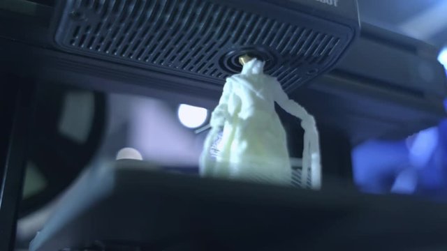 3D printer working close up. Automatic three dimensional 3d printer performs plastic. Modern 3D printer printing an object from the hot molten. Concept progressive additive technology for 3d printing