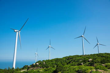 Wind turbines in the mountains near the sea