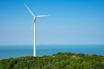 Wind turbines in the mountains near the sea