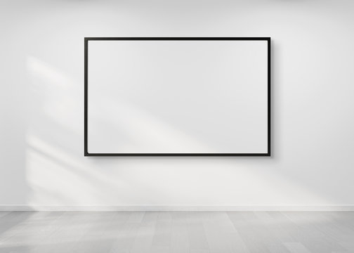 Black frame hanging on a wall mockup 3d rendering
