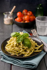 Traditional pasta trofie south of Italy with pesto and basil. Homemade meal for lunch. Copy space.