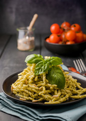 Traditional pasta trofie south of Italy with pesto and basil. Homemade meal for lunch. Copy space.