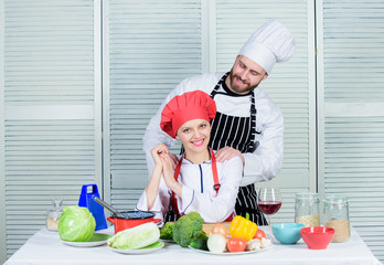 Woman and bearded man culinary partners. Ultimate cooking challenge. Couple compete in culinary arts. Reasons why couples cooking together. Cooking with your spouse can strengthen relationships