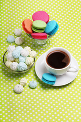 A cup of coffee and macaroons ready for breakfast