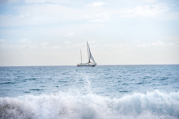 Seascape with white sailboat