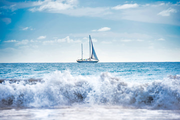 Seascape with white sailboat