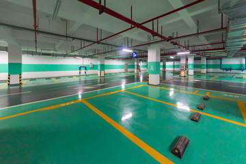 Fototapeta na wymiar Underground parking and ceiling piping systems.