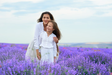 girls are in the lavender flower field, beautiful summer landscape