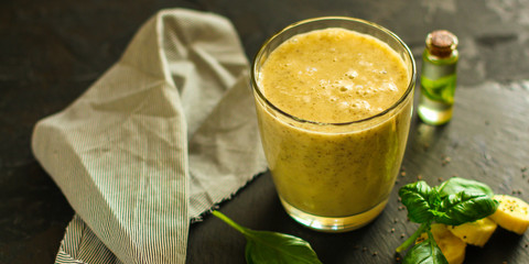 Smoothies, banana, basil, chia seeds and more are healthy food concepts. food background. top view