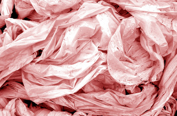 Dirty crumpled pvc in red tone.