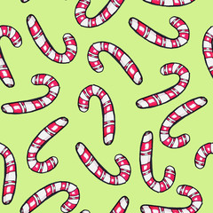 Christmas seamless pattern hand-drawn. New Year candy on a green background.Happy new year.