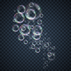 Realistic floating soap bubbles with rainbow reflection on transparent background. Design element for advertising booklet, flyer or poster