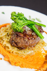 Beef sirloin with sweet potato mousse, curry sauerkraut and fresh thyme sauce