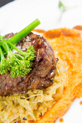 Beef sirloin with sweet potato mousse, curry sauerkraut and fresh thyme sauce