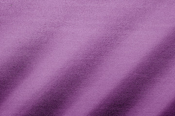 Fototapeta na wymiar Plastic glittering texture in purple tone.