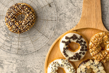 bakery food background of assortment of donut in tray on table