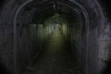 Fototapeta na wymiar Underground passages of the Vladivostok fortress. Underground tunnel of Russian forts in Vladivostok