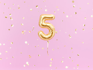 Fototapeta Five year birthday. Number 5 flying foil balloon on pink. Five-year anniversary gold confetti background. 3d rendering obraz