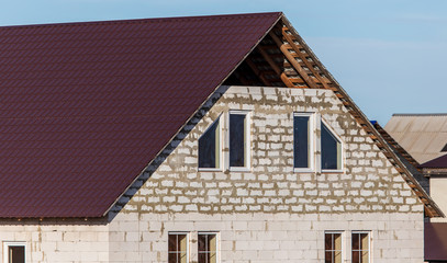 Metal roof in the house against the sky