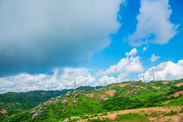 Fototapeta na wymiar Wind turbines in the mountains near the sea