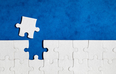 Jigsaw puzzle with missing piece. Missing puzzle pieces. Concept image of unfinished task. Completing final task, missing jigsaw puzzle pieces and business concept with a puzzle piece missing.