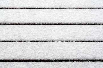 Fototapeta premium Fresh white snow attacked the boards