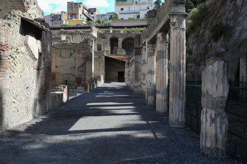 Fototapeta na wymiar Marble columns in City of Herculaneum near Naples, Italy 