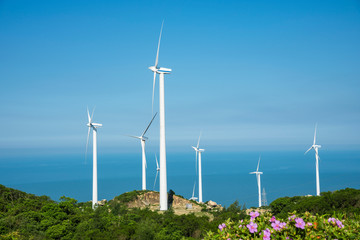 Wind turbines in the mountains near the sea