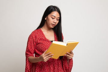 Young Asian woman read a book.