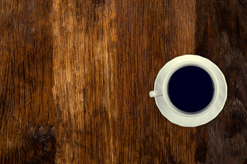 Coffee served on an old wooden table. View from above. Empty space for copying and pasting text.