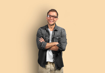 Young man in denim shirt is smiling