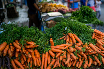 Bunches of carrots on a market stall. Fresh and organic vegetables at farmers market. Organic, agriculture products. Freshly, seasonal harvested vegetables. Bio, healthy food. Vegetarian food.