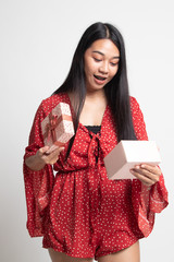 Young Asian woman open a gift box.