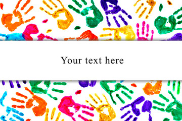 Abstract background made from colored handprints.