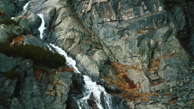 4K slightly sliding footage of water running down Skok waterfall in Slovakia
