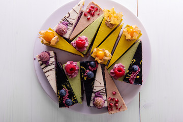 random selection of healthy vegan raw colorful  fruit cakes 